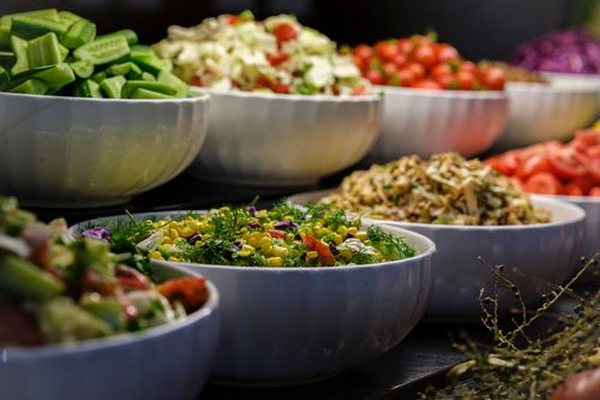 Fresh colorful bowls of vegetables and healthy food